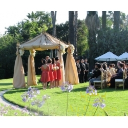 Iron square arch with ivory draping and 4 flower arrangement