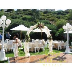 Iron white arch with draping  and 3 flower arrangement